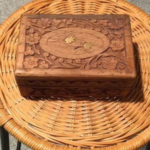 Wooden jewelry box with copper metal design on top